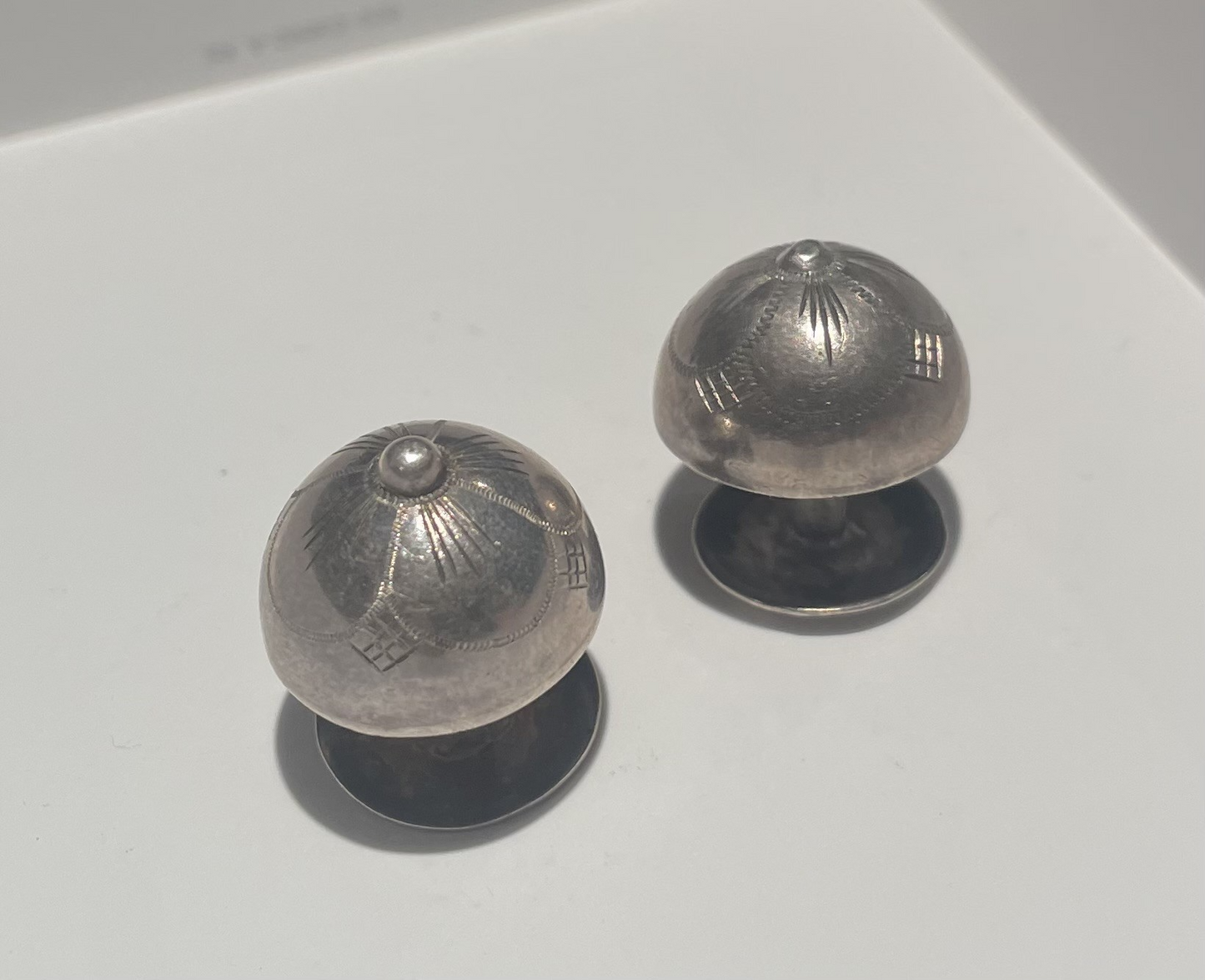 A pair of silver cufflinks stamped 830s - no. 09700