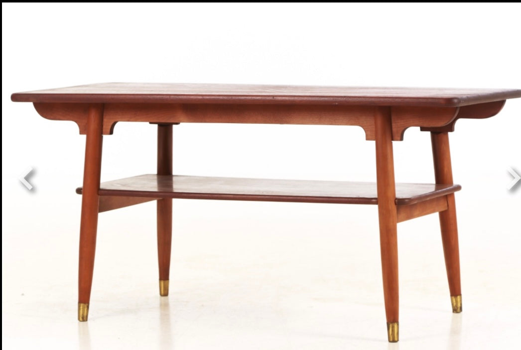 Beautiful coffee table from the 1950s-60s, with solid teak top and frame in beech and brass shoes - no. 0910